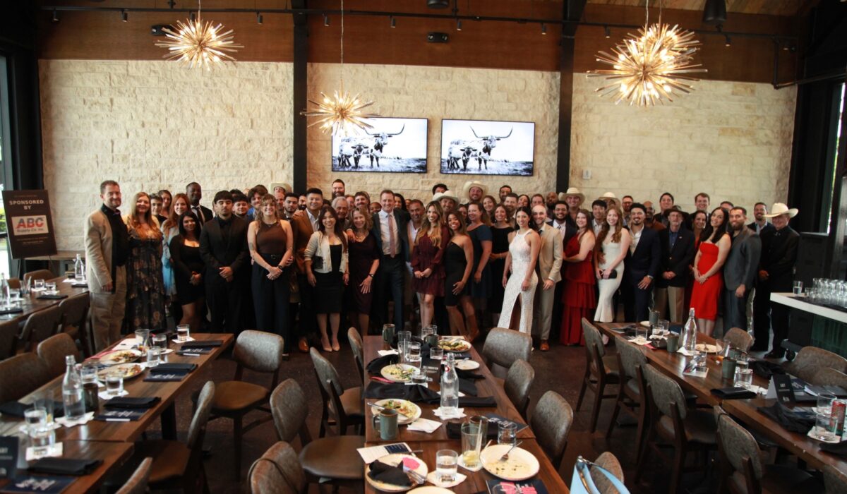 DC Pines Roofing full team gathered together at a company event in Houston