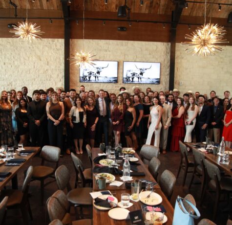 DC Pines Roofing full team gathered together at a company event in Houston