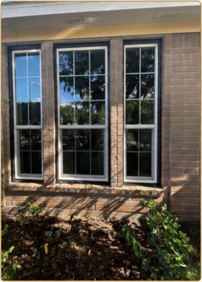 Three-lite window wall with colonial grids