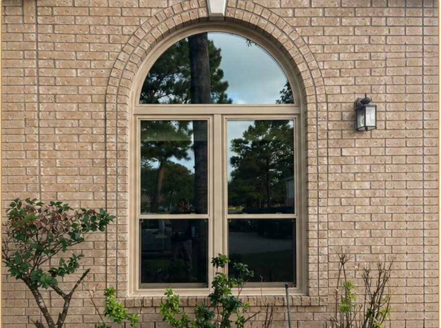 Arched window upgrade on a Houston brick home
