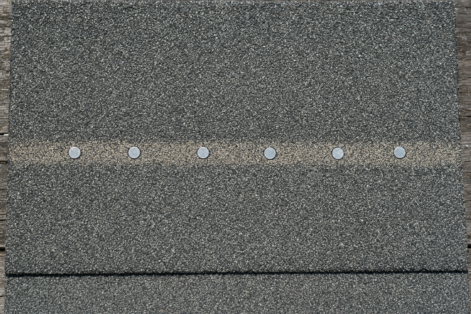 Six nails driven perfectly on the printed nail line at correct depth