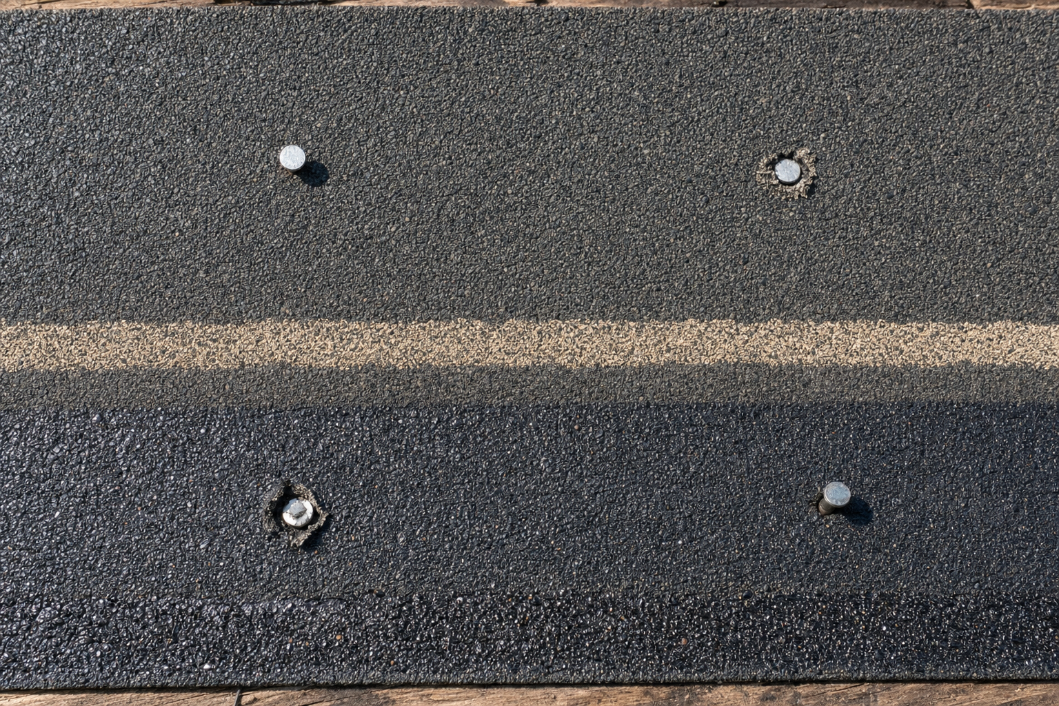 Four nails placed above and below the nail line, one over-driven and one under-driven