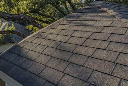 Aged charcoal asphalt shingle roof on a Houston home showing sun-fade from Houston roof shingle heat aging