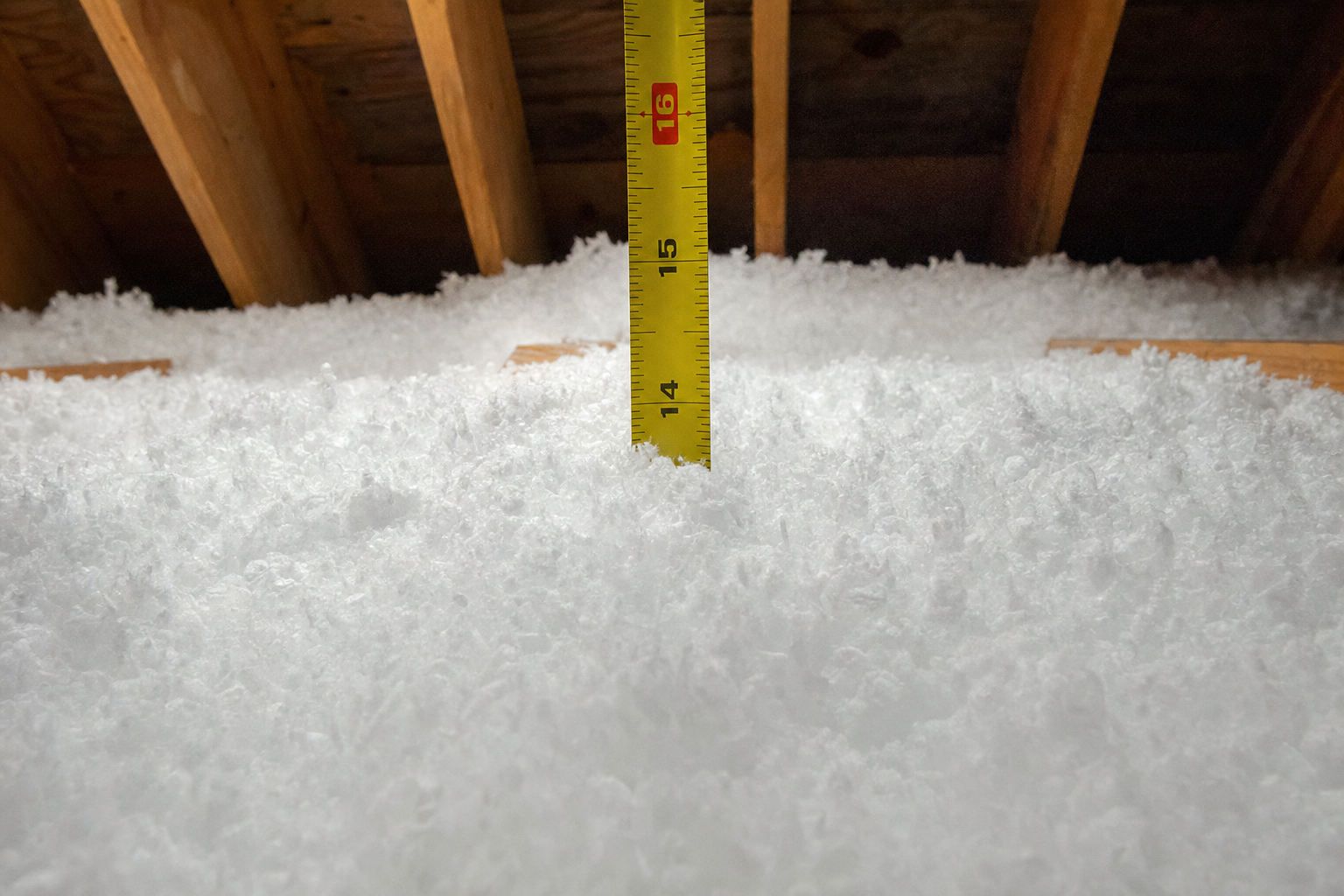 R-49 blown-in fiberglass insulation depth — approximately 16 inches, measured on-site by DC Pines