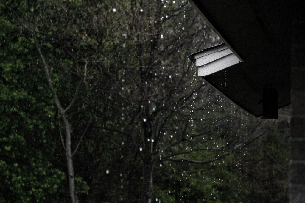 Rain running off a Houston roof edge