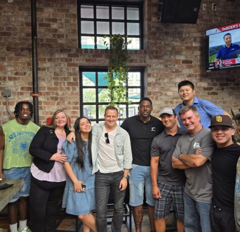 DC Pines Roofing team on a Houston jobsite reviewing craftsmanship