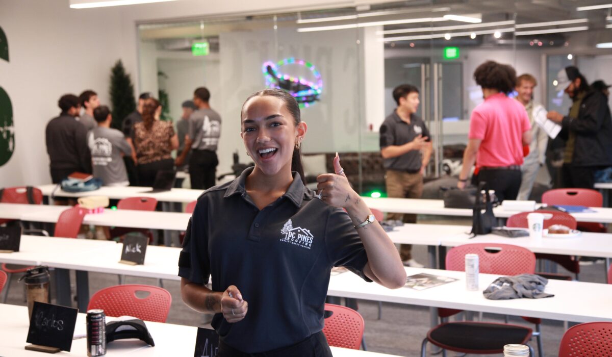 DC Pines Roofing team member in branded polo at company gathering in Houston