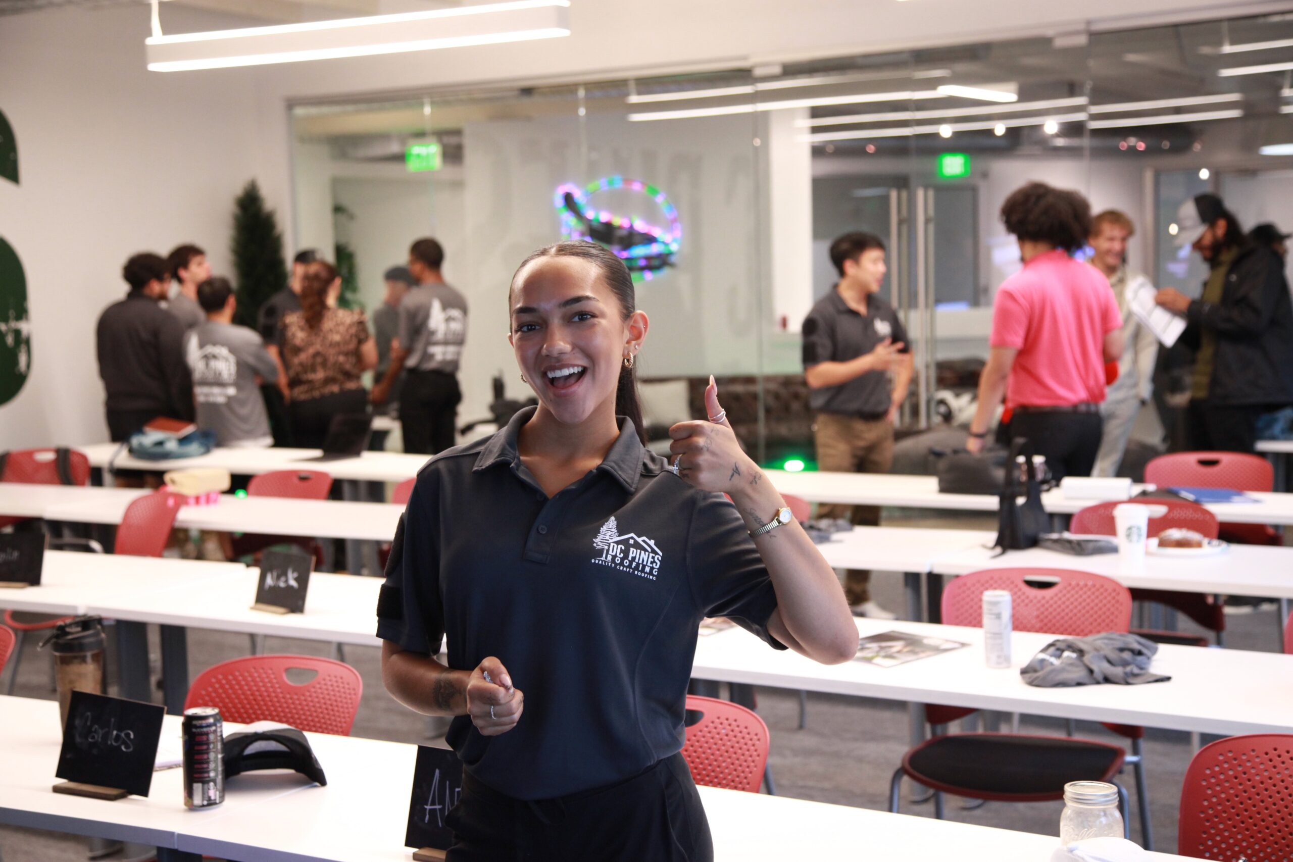 DC Pines Roofing team member in branded polo at company gathering in Houston