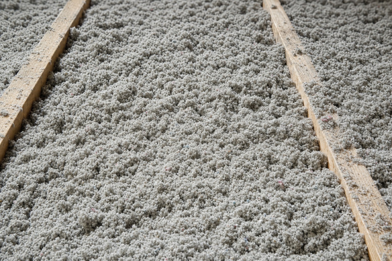 Blown-in cellulose insulation between attic joists