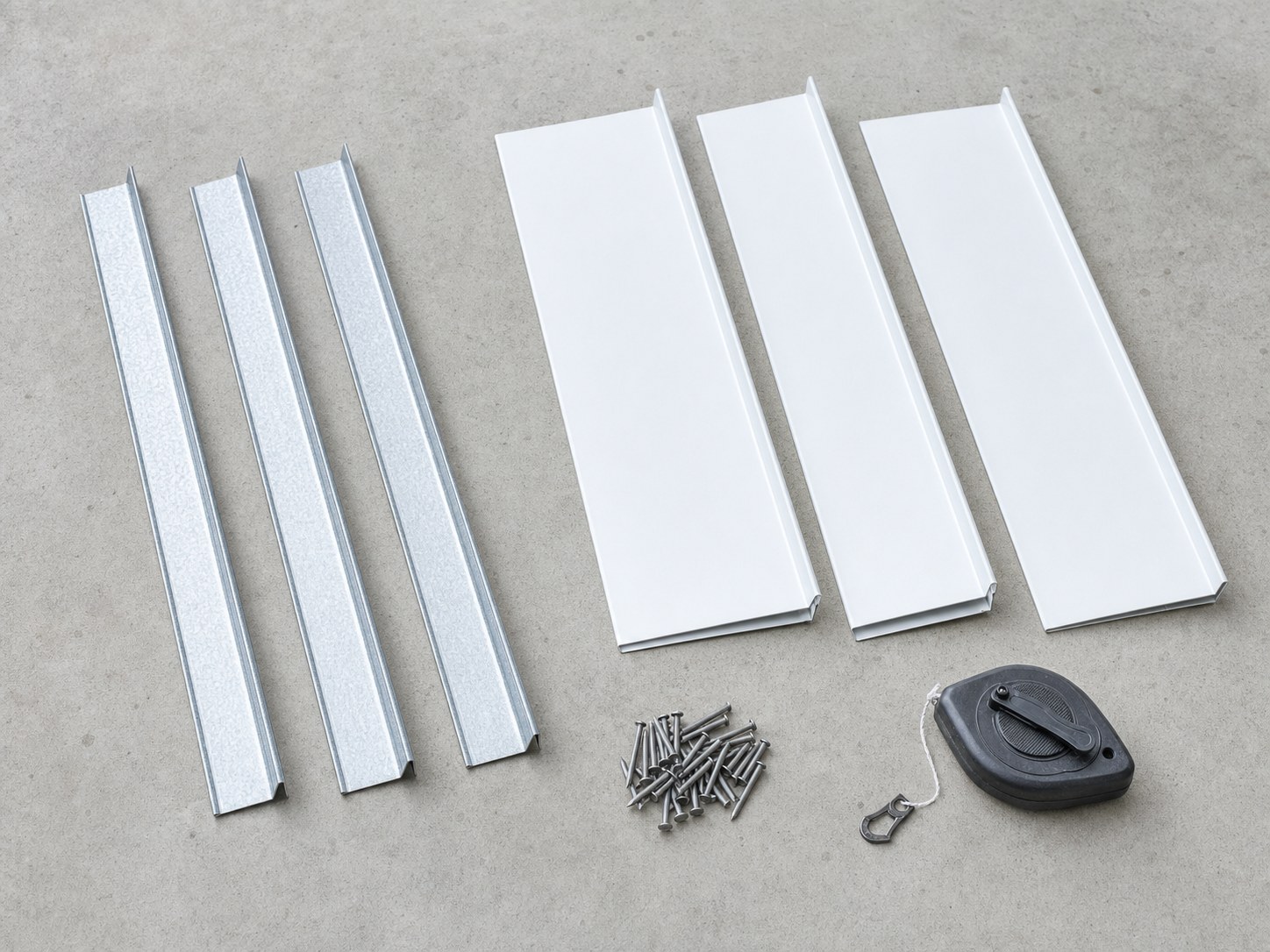Comparison of galvanized drip edge and white aluminum gutter apron components with roofing nails
