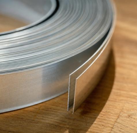 Cross-section of aluminum gutter coil showing thickness for houston aluminum gutter thickness comparison