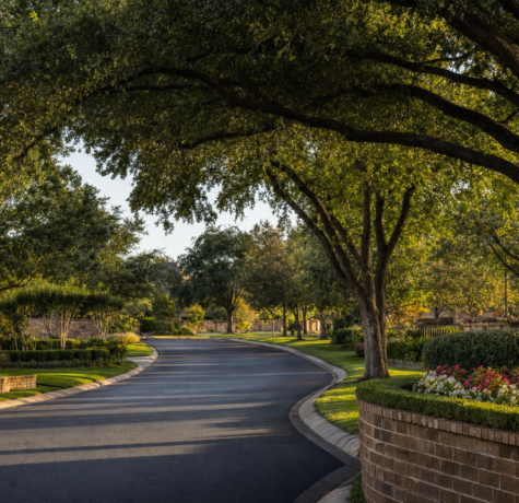 Sugar Land Houston master-planned community entrance with mature live oaks