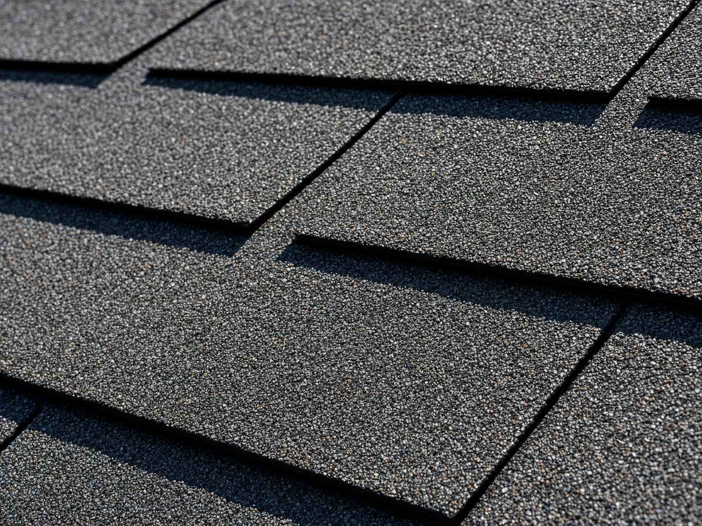 Close-up of new architectural asphalt shingles on a Houston home showing crisp granule color and factory-fresh detail