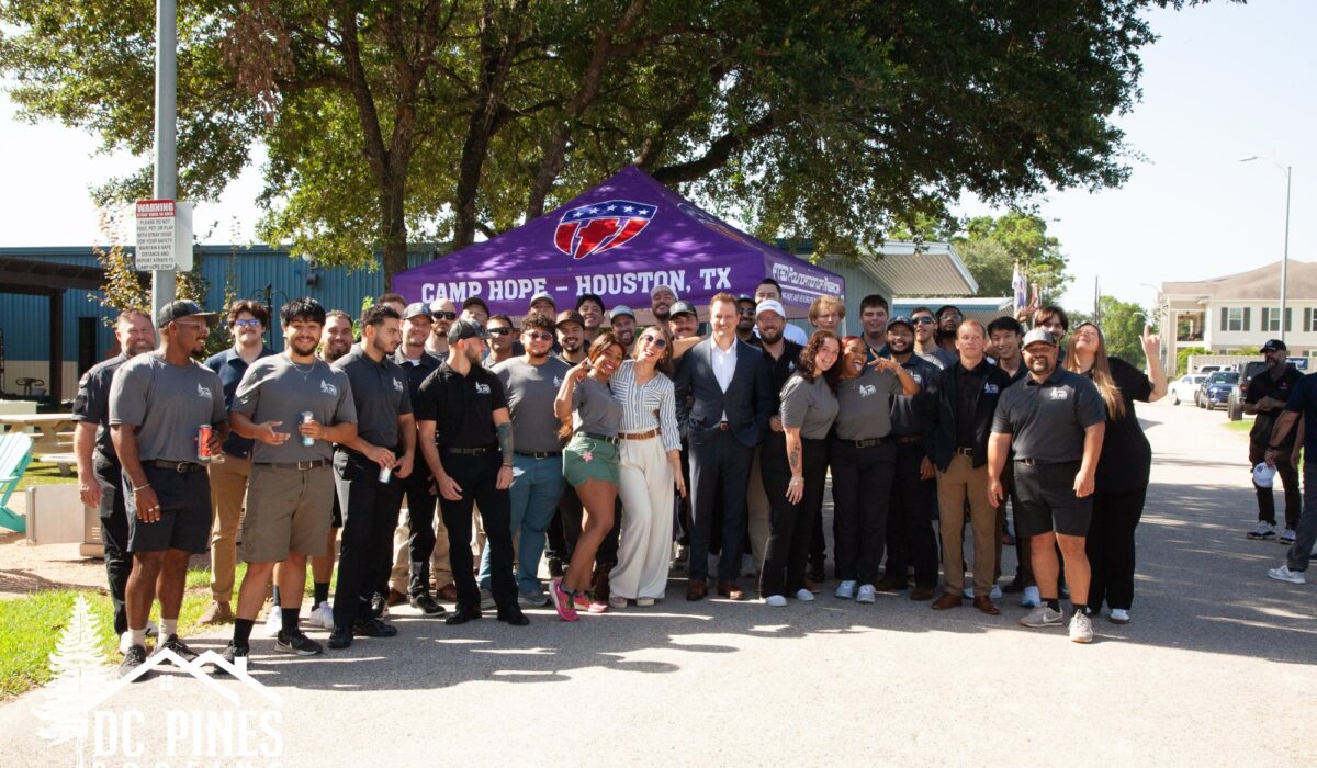 DC Pines Roofing team group photo at the DC Pines Camp Hope visit in Houston