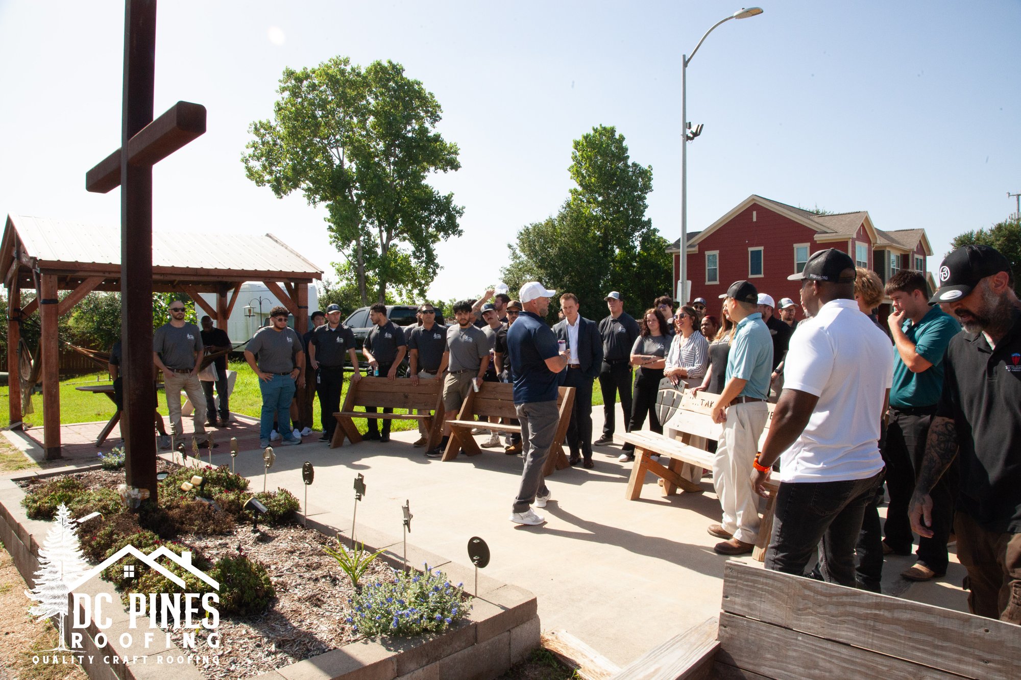 DC Pines team at the outdoor memorial garden on the Camp Hope campus