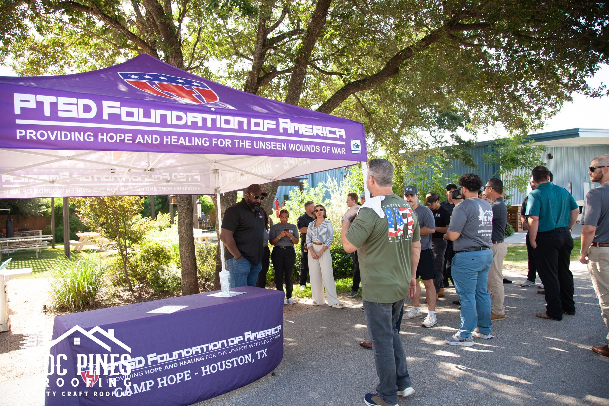 DC Pines team gathered at the PTSD Foundation of America tent at Camp Hope in Houston