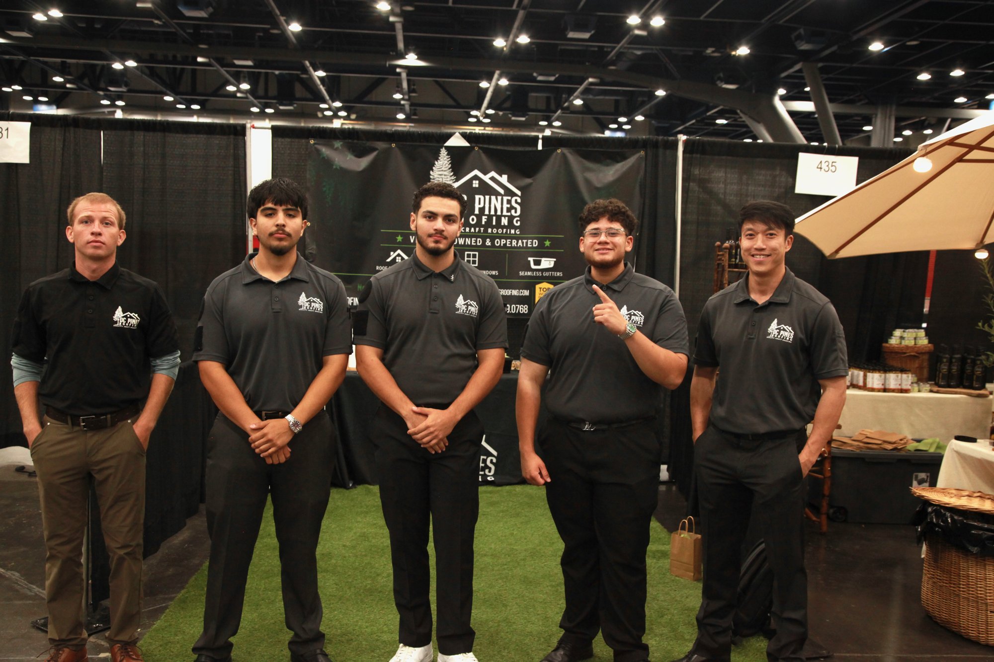 DC Pines Roofing team at the company booth at a Houston home show